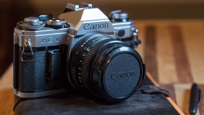 A Canon 35mm film SLR and lens